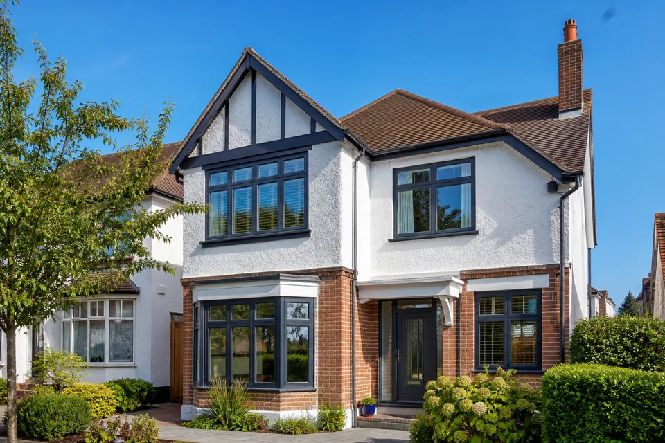 Modern British home exterior with dark-framed windows
